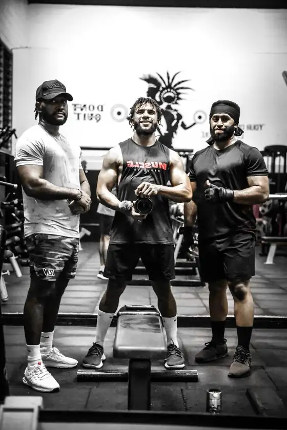 Josh and clients together on the gym floor