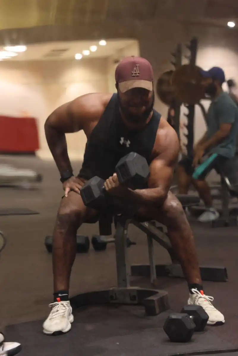 Josh training through the last rep of a heavy dumbbell curl